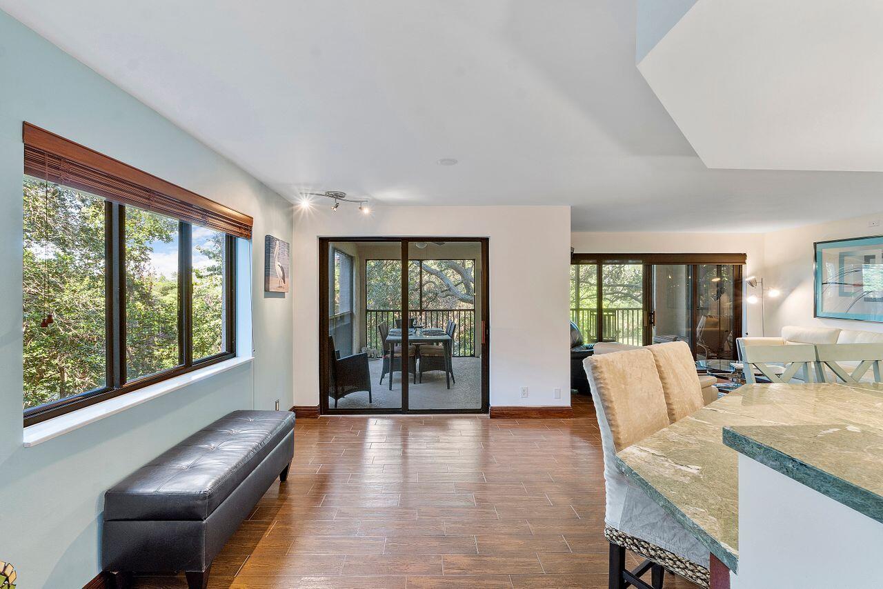 500 Ocean Trail Way, Unit 201 Jupiter, FL 33477 - Photo 13 of 58 a living room with furniture and large windows