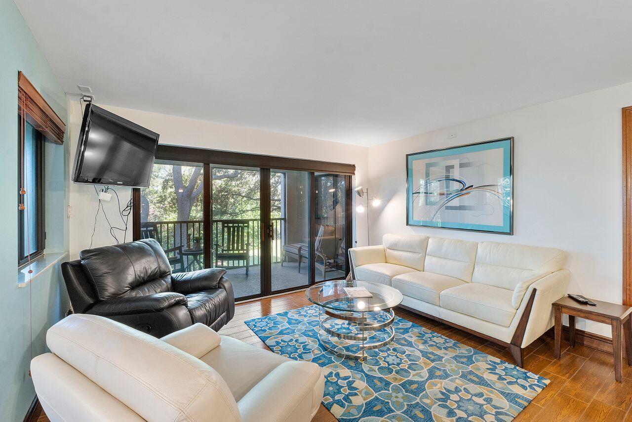 500 Ocean Trail Way, Unit 201 Jupiter, FL 33477 - Photo 16 of 58 a living room with furniture and a large window