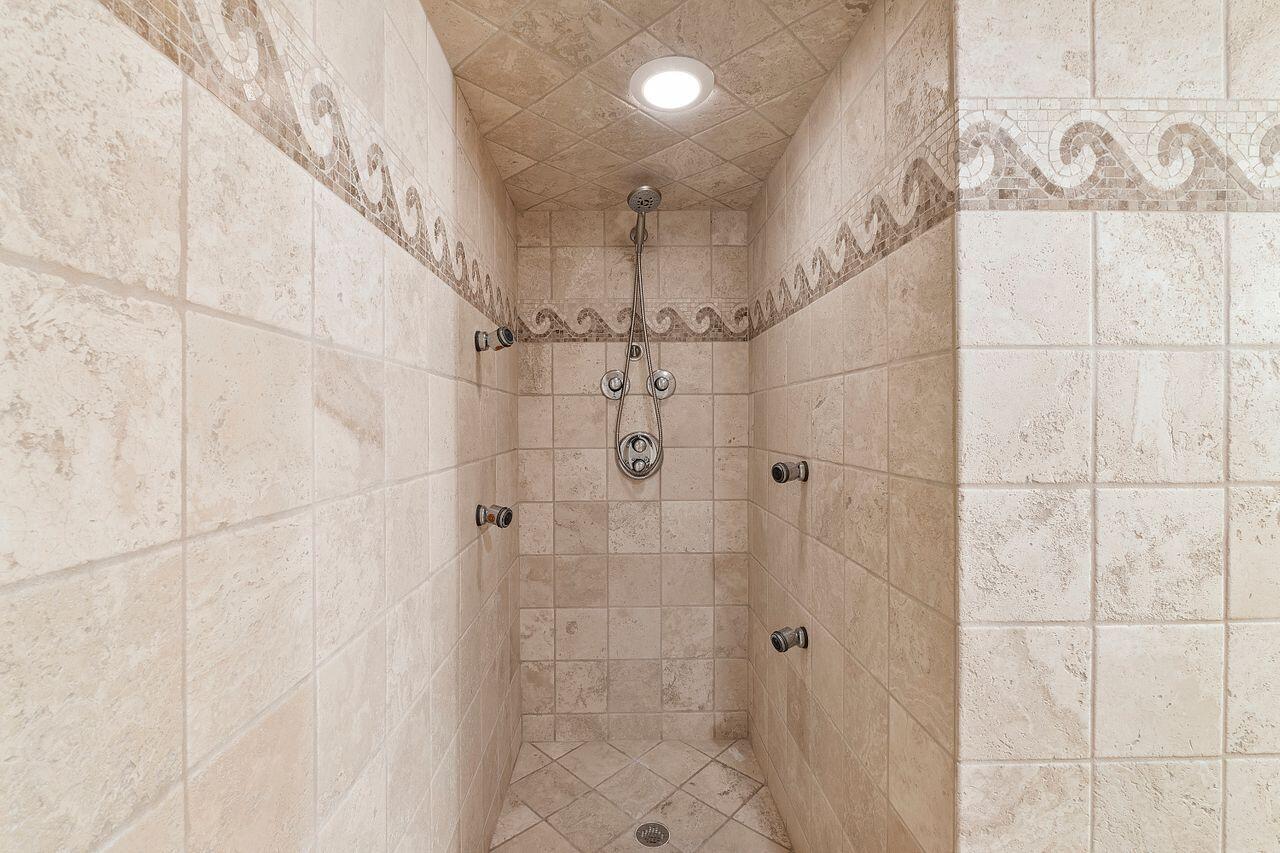 500 Ocean Trail Way, Unit 201 Jupiter, FL 33477 - Photo 27 of 58 a bathroom with a shower