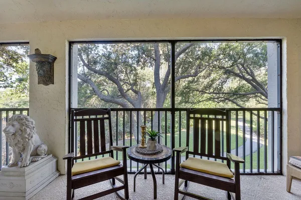 a view of swimming pool with outdoor seating and city view