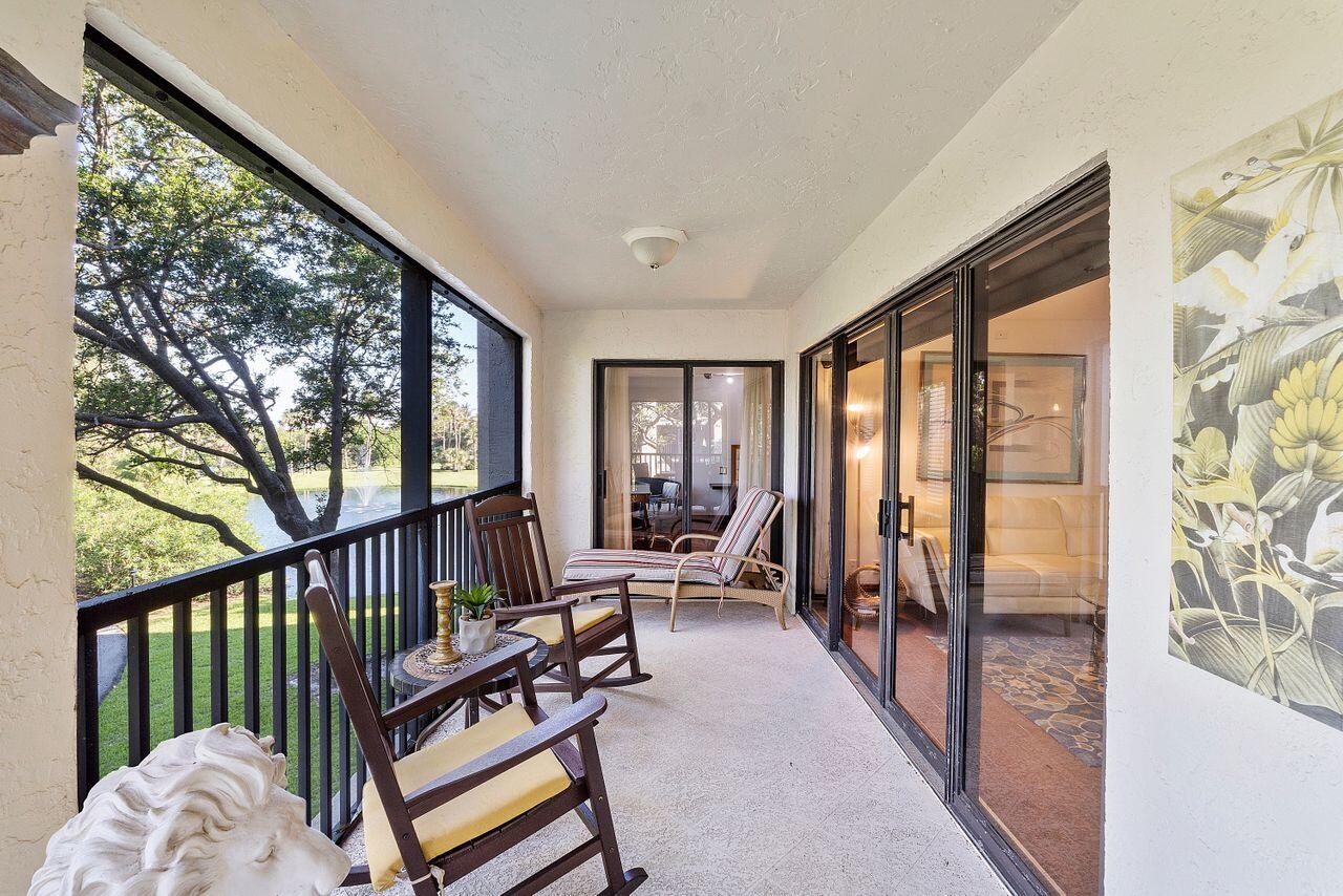 500 Ocean Trail Way, Unit 201 Jupiter, FL 33477 - Photo 34 of 58 a living room with furniture and a large window