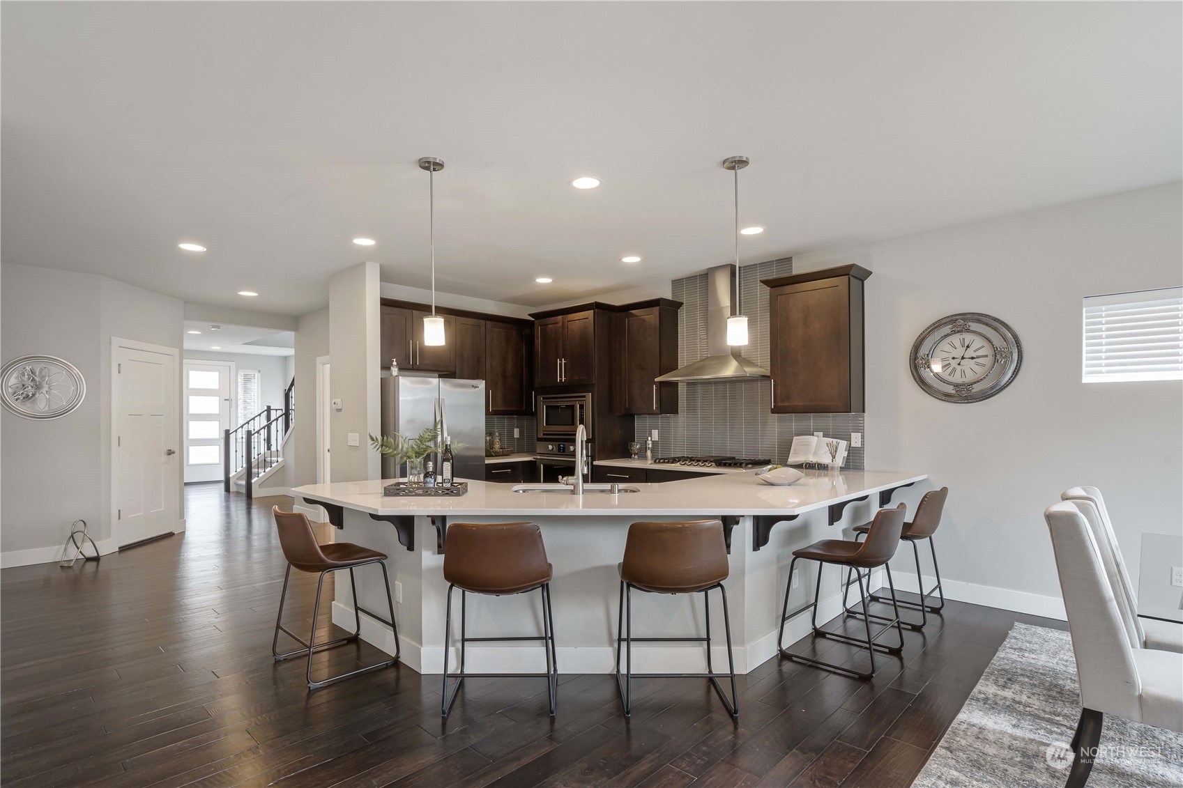 114 176th Place Southwest Bothell, WA 98012 - Photo 11 of 31 a kitchen with a dining table chairs and wooden floor