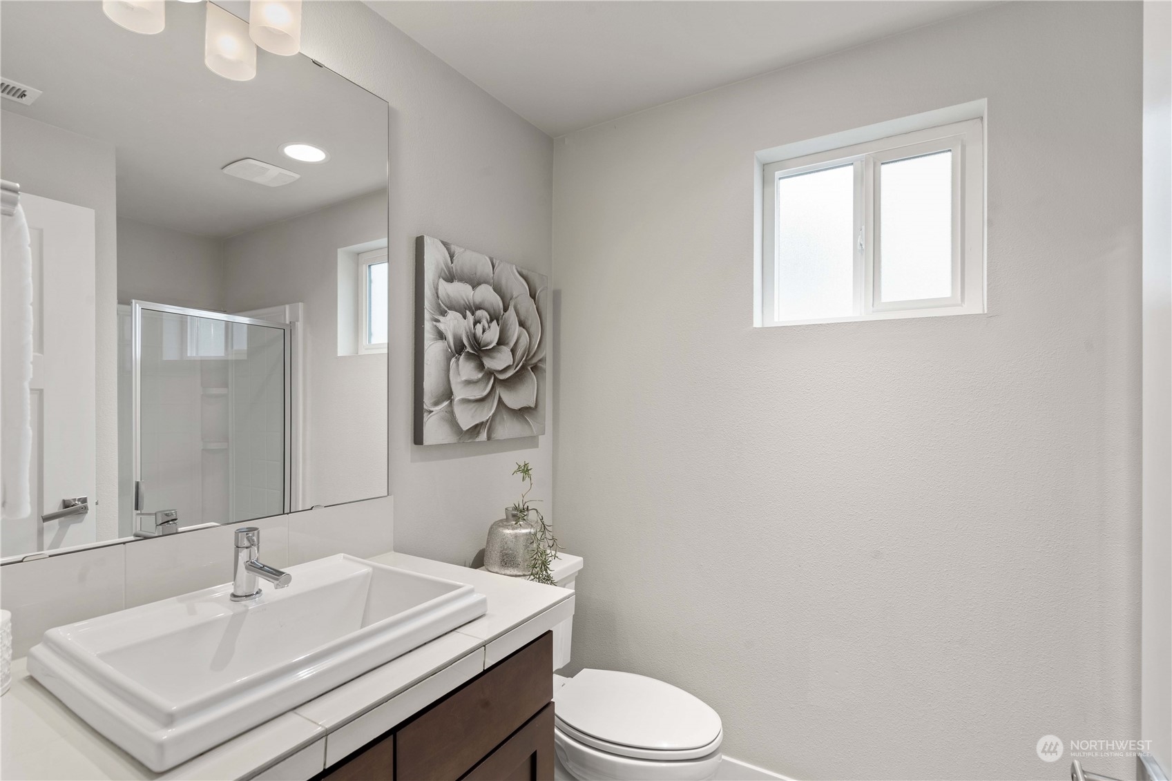 114 176th Place Southwest Bothell, WA 98012 - Photo 5 of 31 a bathroom with a sink a toilet and mirror