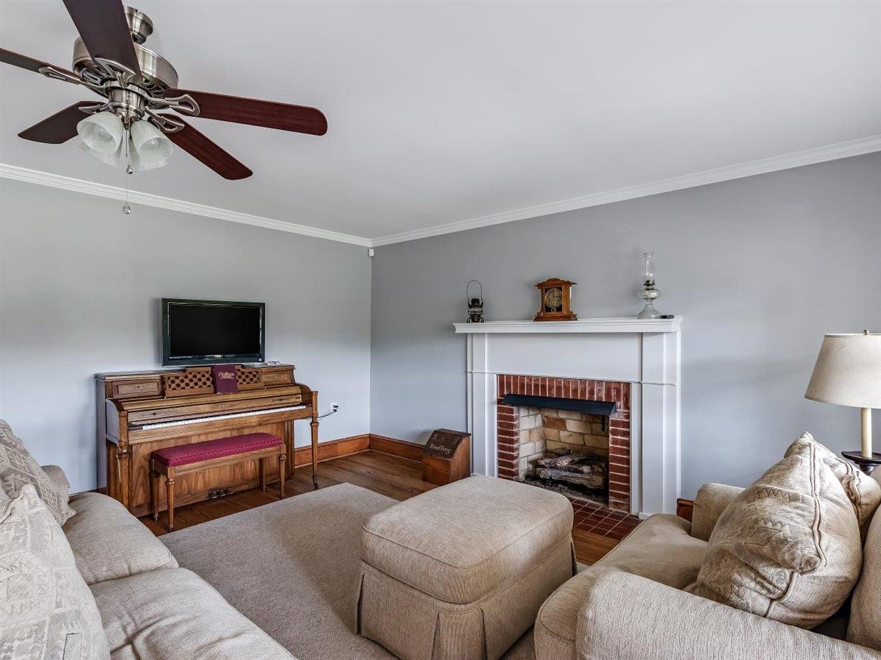 5609 Dona Road Julian, NC 27283 - Photo 12 of 63 a living room with furniture and a fireplace