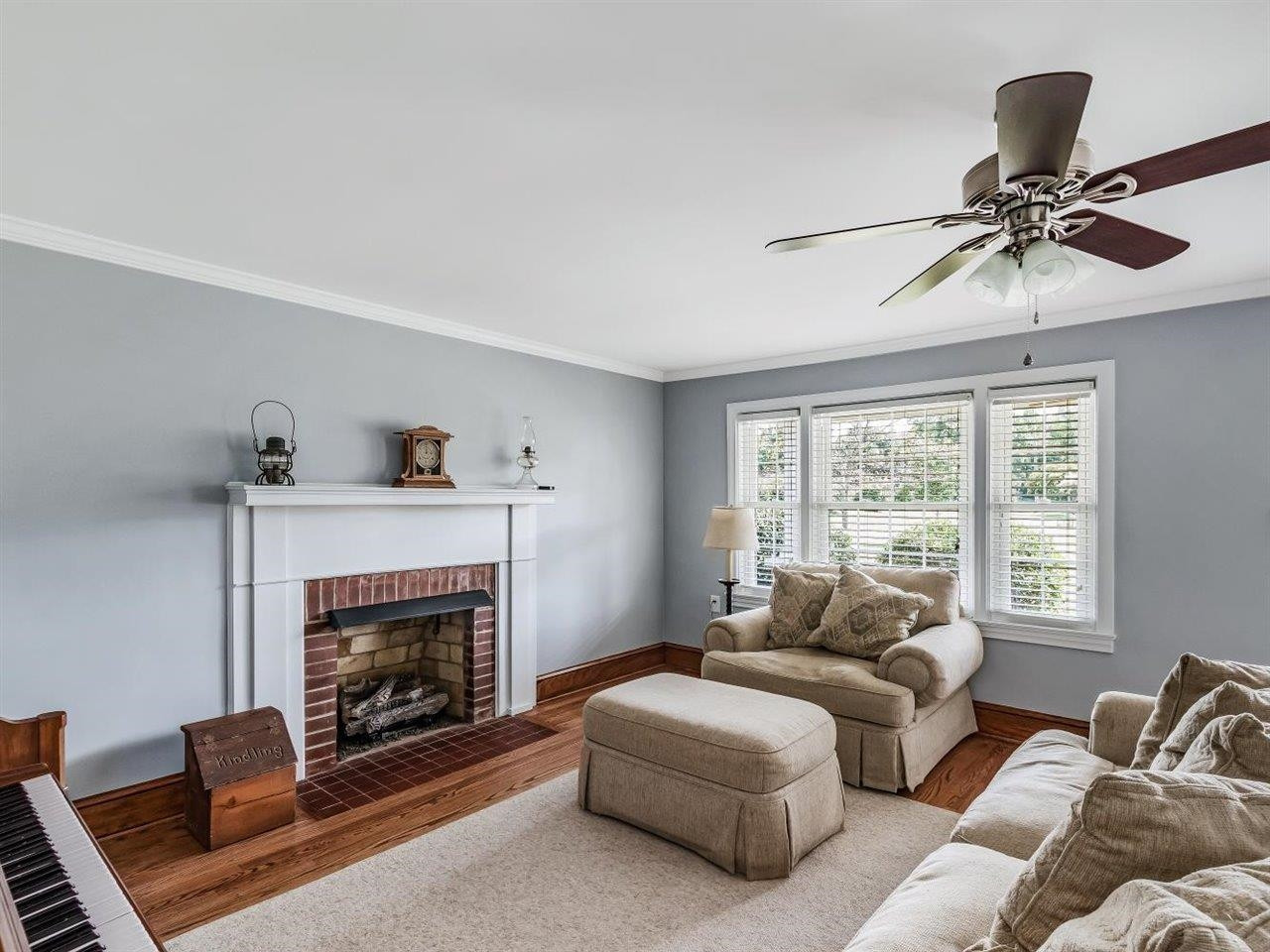 5609 Dona Road Julian, NC 27283 - Photo 13 of 63 a living room with furniture a window and a fireplace