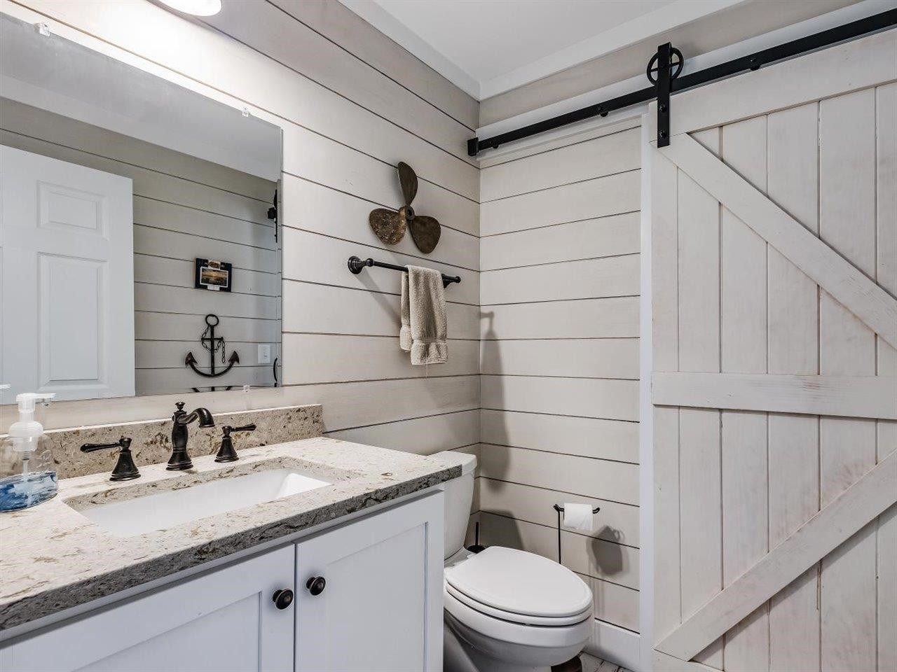 5609 Dona Road Julian, NC 27283 - Photo 14 of 63 a bathroom with a granite countertop sink toilet and shower