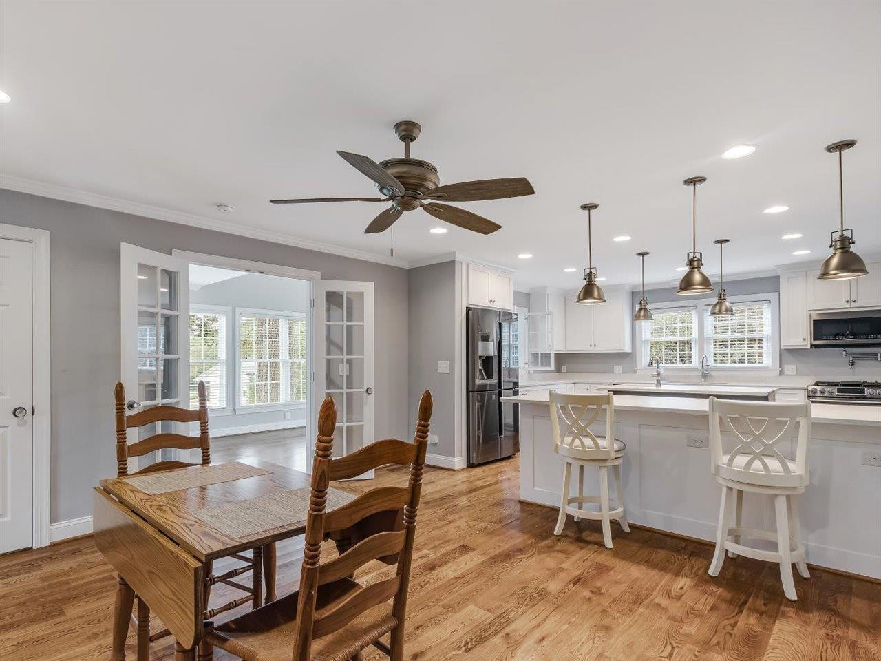 5609 Dona Road Julian, NC 27283 - Photo 27 of 63 a living room with stainless steel appliances kitchen island granite countertop furniture and a large window