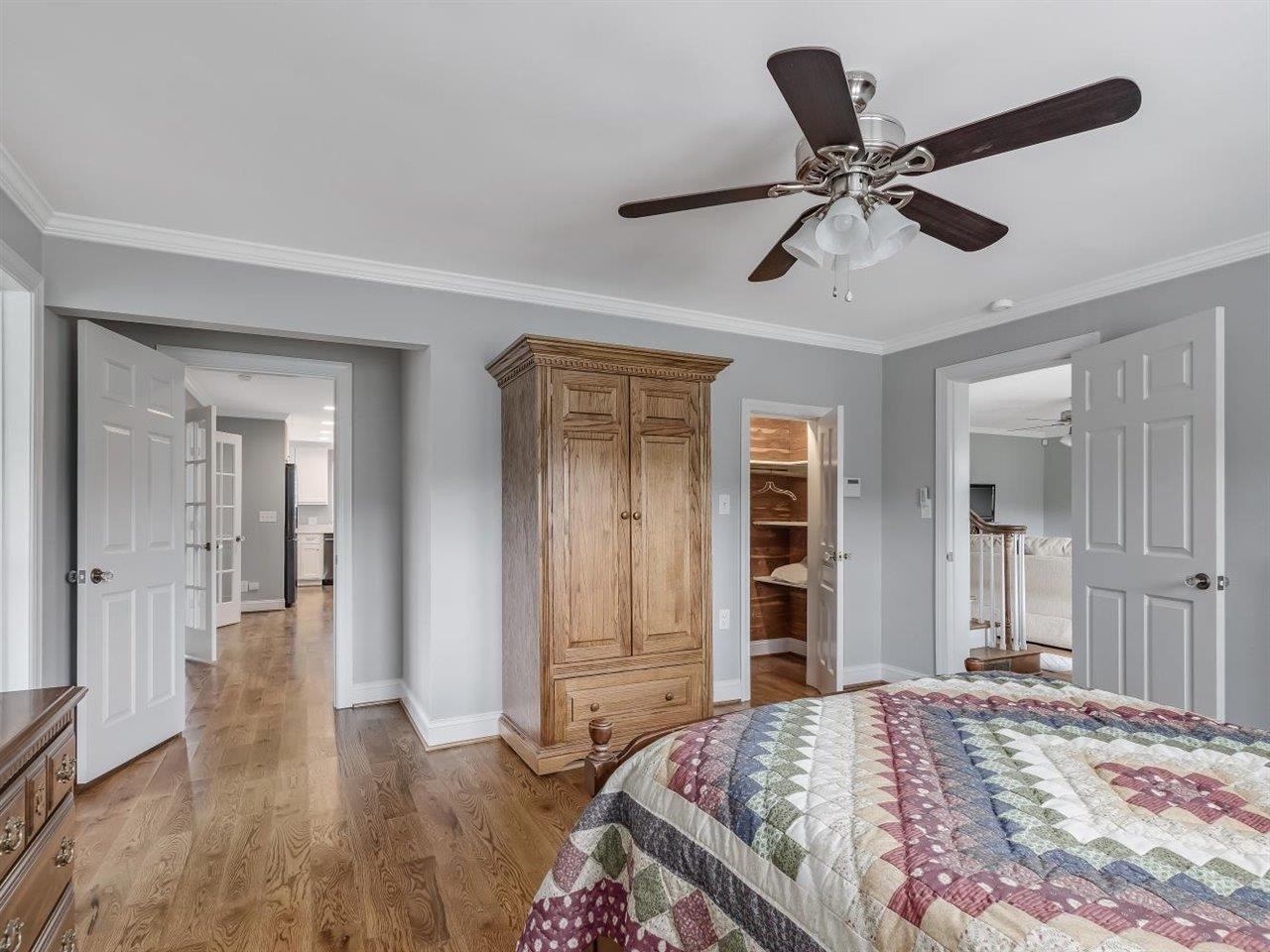 5609 Dona Road Julian, NC 27283 - Photo 34 of 63 a bedroom with a bed and a chandelier