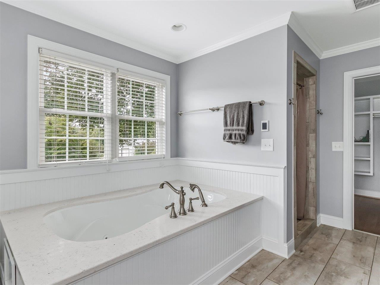 5609 Dona Road Julian, NC 27283 - Photo 35 of 63 a bathroom with a bathtub and a window