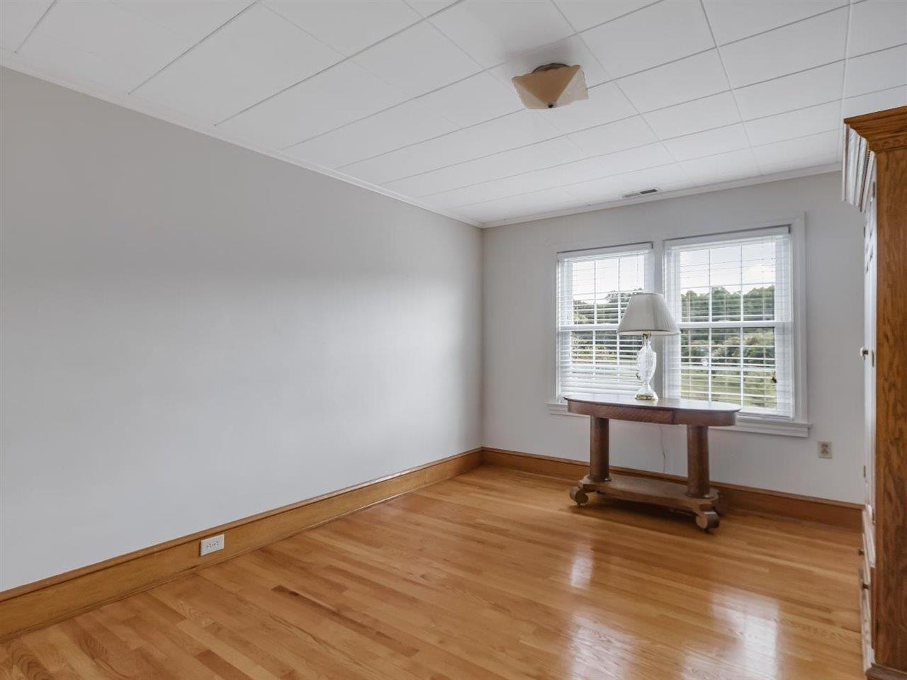 5609 Dona Road Julian, NC 27283 - Photo 39 of 63 a view of a room with wooden floor and windows