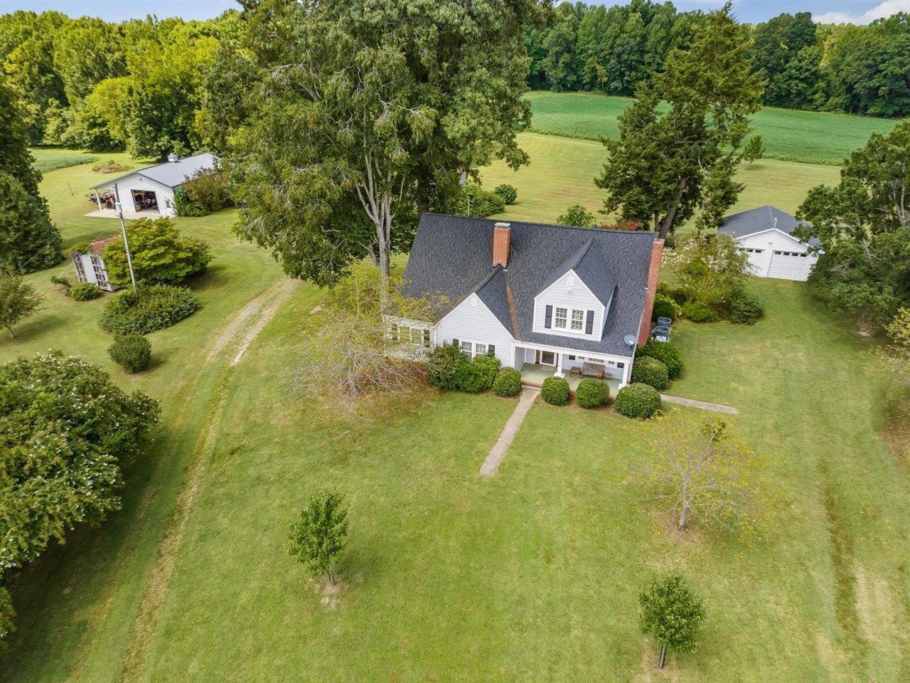 5609 Dona Road Julian, NC 27283 - Photo 4 of 63 an aerial view of a house with a yard basket ball court and outdoor seating