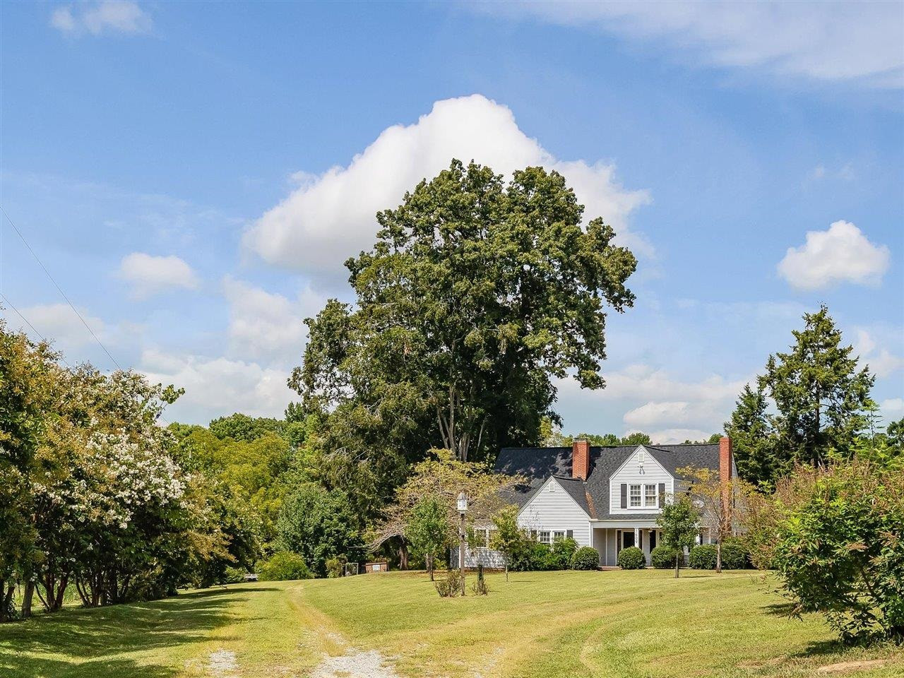 5609 Dona Road Julian, NC 27283 - Photo 5 of 63 a front view of a house with a yard and garage