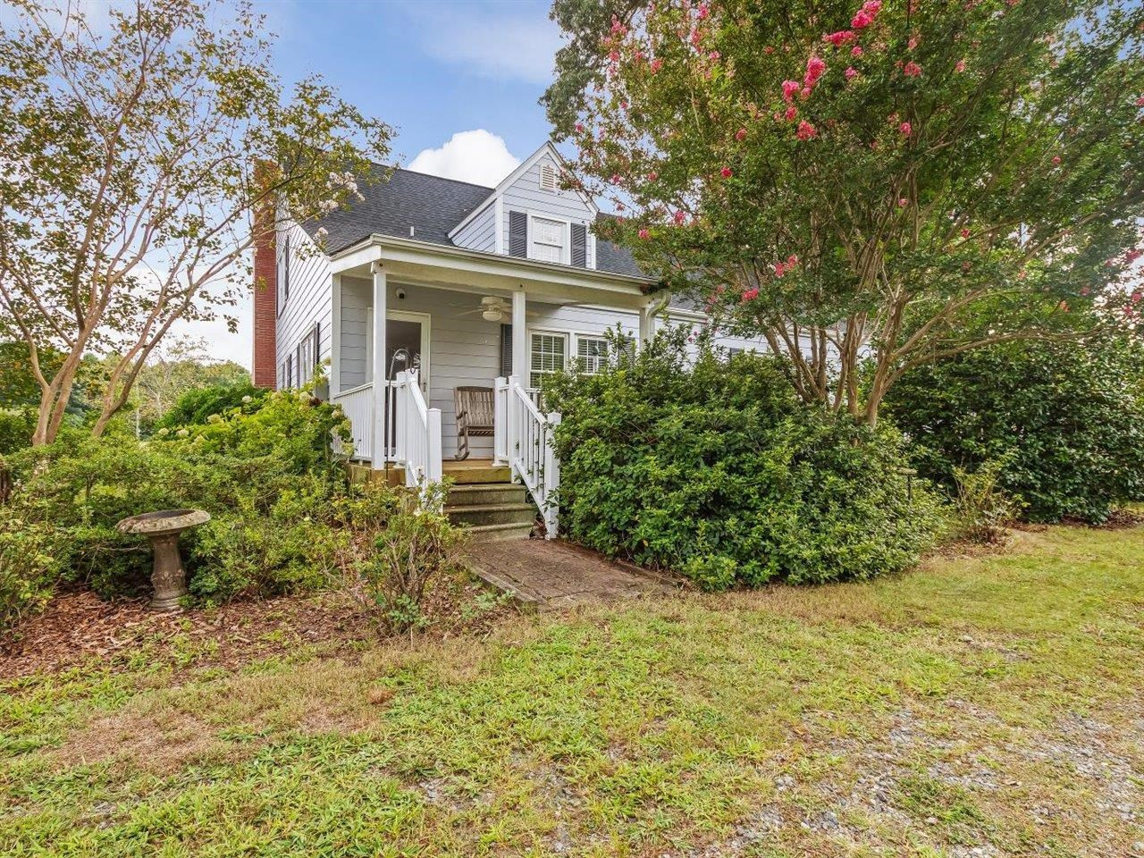 5609 Dona Road Julian, NC 27283 - Photo 51 of 63 a front view of a house with garden