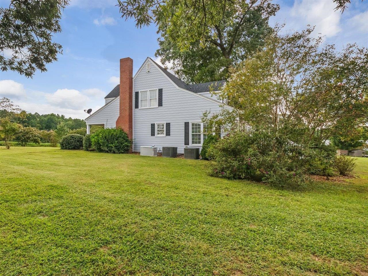 5609 Dona Road Julian, NC 27283 - Photo 52 of 63 a view of a house with a yard