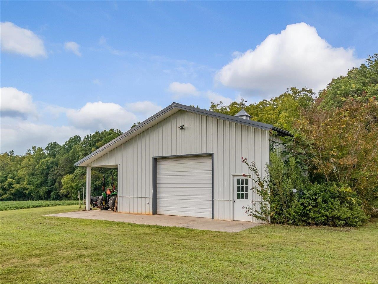 5609 Dona Road Julian, NC 27283 - Photo 54 of 63 a view of a house with backyard and garden