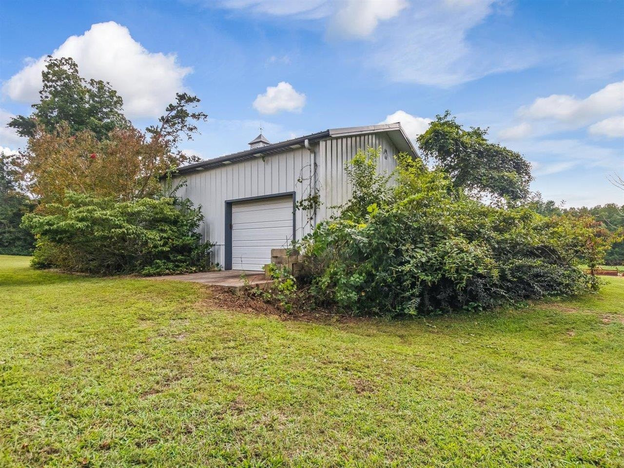 5609 Dona Road Julian, NC 27283 - Photo 55 of 63 a view of a house with a yard