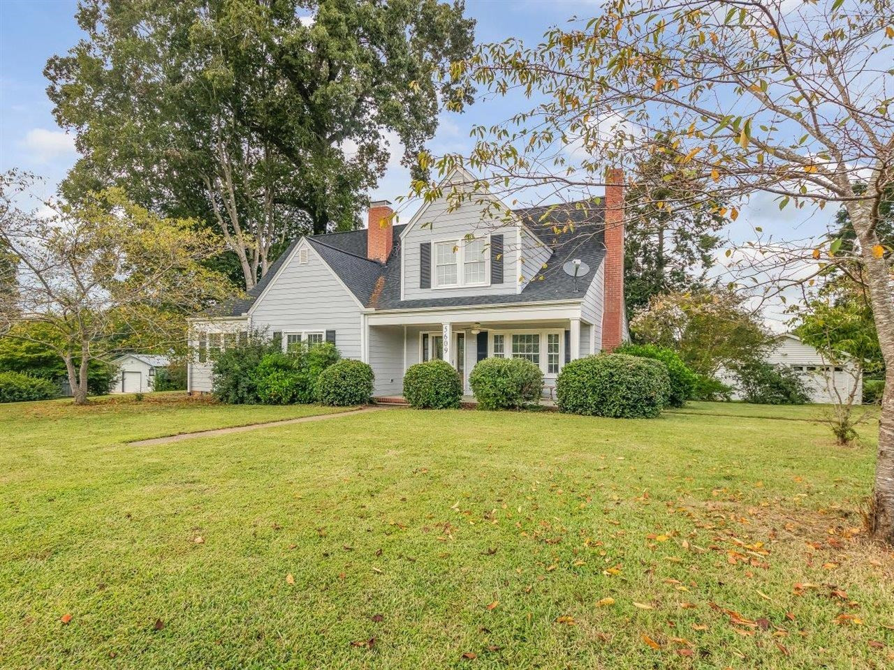 5609 Dona Road Julian, NC 27283 - Photo 7 of 63 a view of a big house with a big yard and large trees
