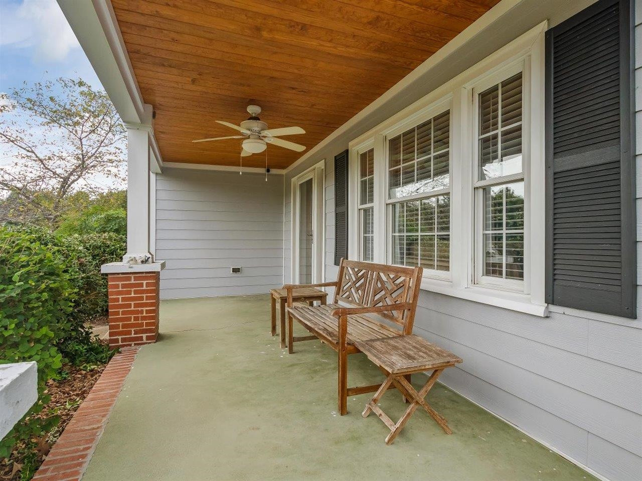 5609 Dona Road Julian, NC 27283 - Photo 8 of 63 a wooden bench sitting in front of a building