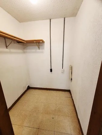 a view of a room with racks on the wall