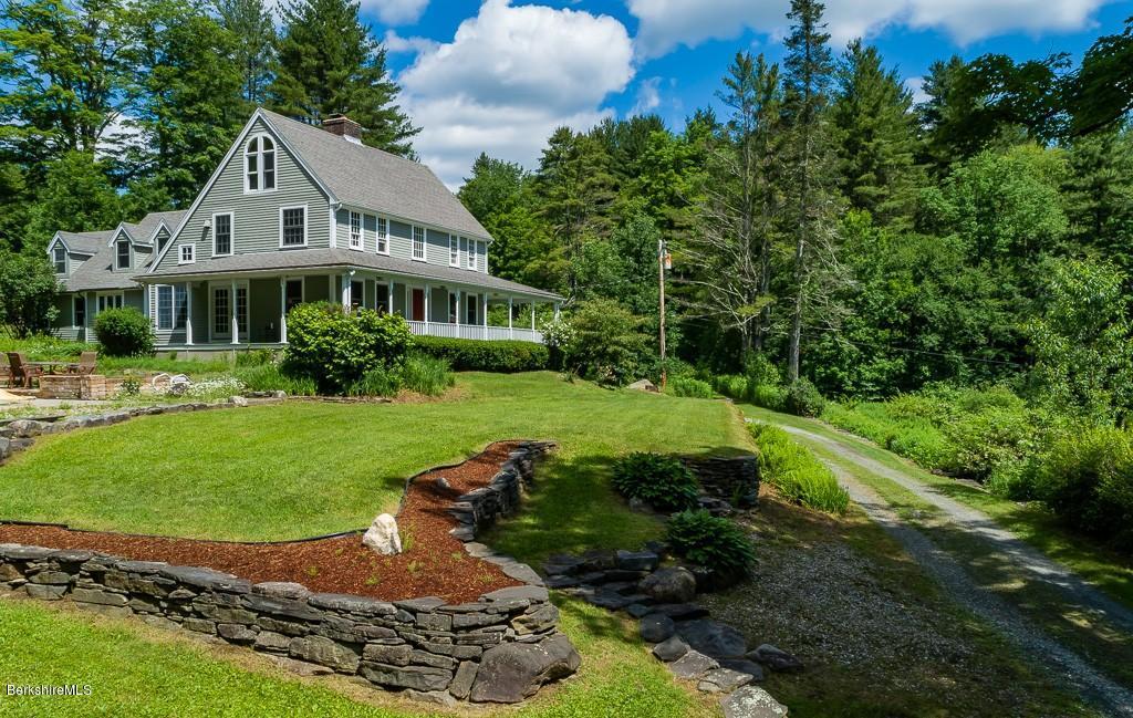 430 East River Road Chester, MA 01011 - Photo 1 of 42 a view of a house with a yard and potted plants