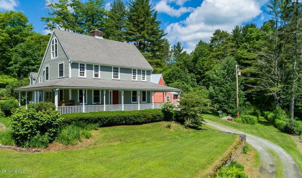 430 East River Road Chester, MA 01011 - Photo 2 of 42 a aerial view of a house with a yard and potted plants