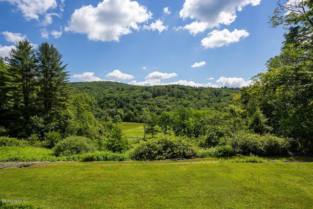 430 East River Road Chester, MA 01011 - Photo 11 of 42 a view of a golf course with a lake