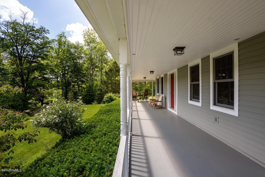 430 East River Road Chester, MA 01011 - Photo 12 of 42 a view of a house with backyard and porch