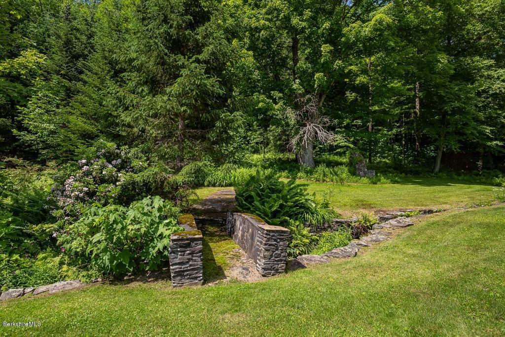 430 East River Road Chester, MA 01011 - Photo 13 of 42 a view of a backyard with chairs