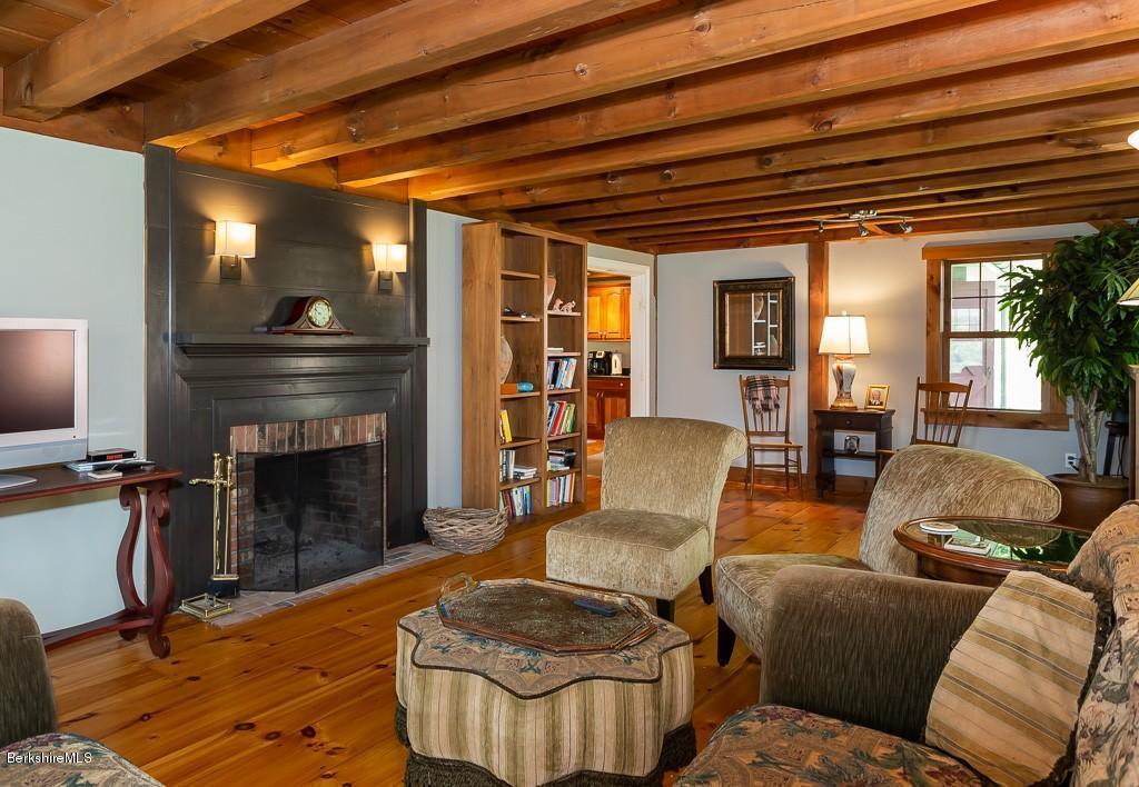 430 East River Road Chester, MA 01011 - Photo 16 of 42 a living room with furniture and a fireplace