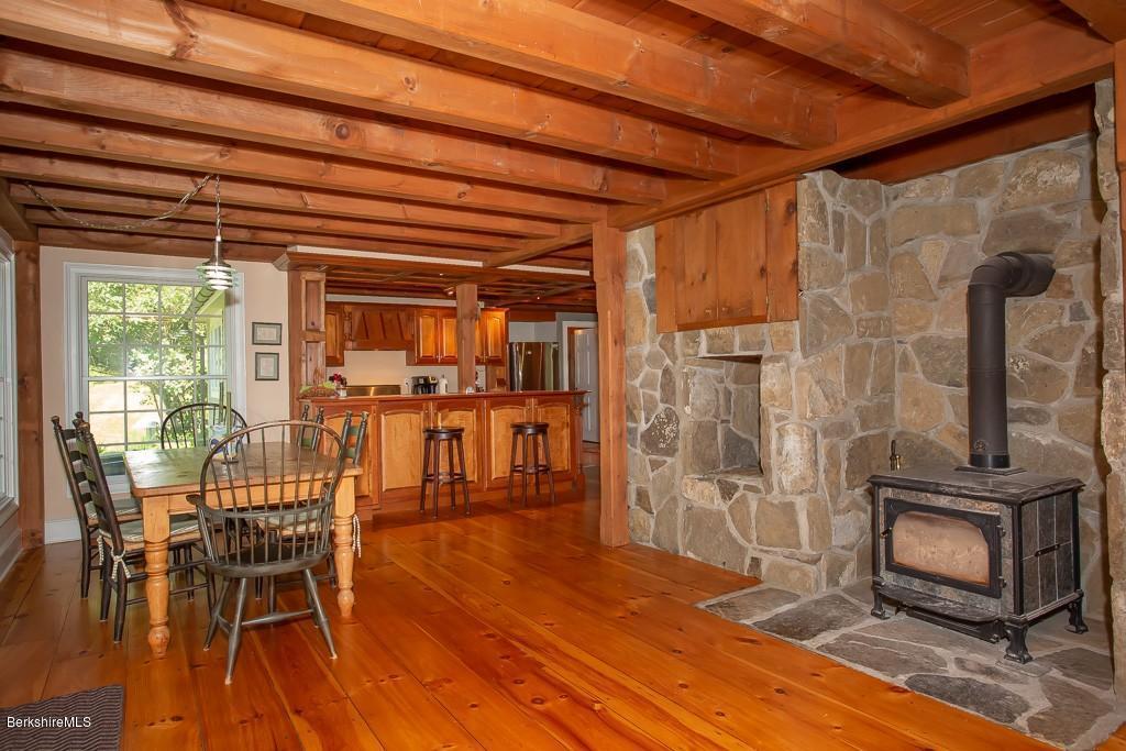 430 East River Road Chester, MA 01011 - Photo 22 of 42 a dining room with furniture and wooden floor