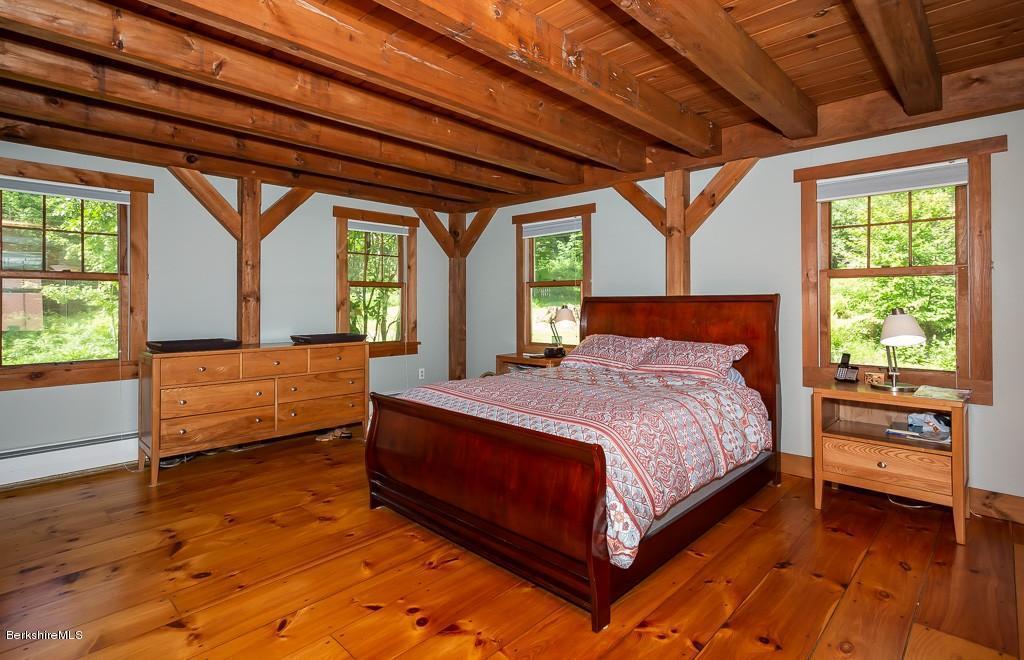 430 East River Road Chester, MA 01011 - Photo 28 of 42 a bedroom with a bed and large windows