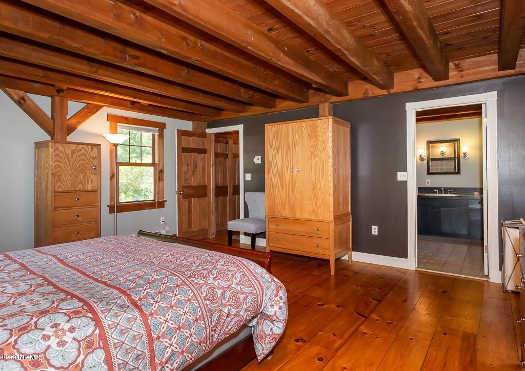 430 East River Road Chester, MA 01011 - Photo 29 of 42 a bedroom with a bed and a large window