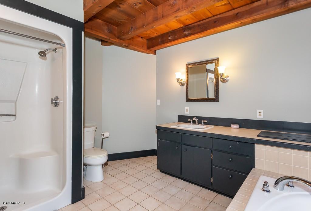 430 East River Road Chester, MA 01011 - Photo 31 of 42 a bathroom with a toilet sink and mirror