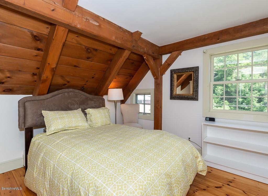 430 East River Road Chester, MA 01011 - Photo 35 of 42 a bedroom with a bed and a large window