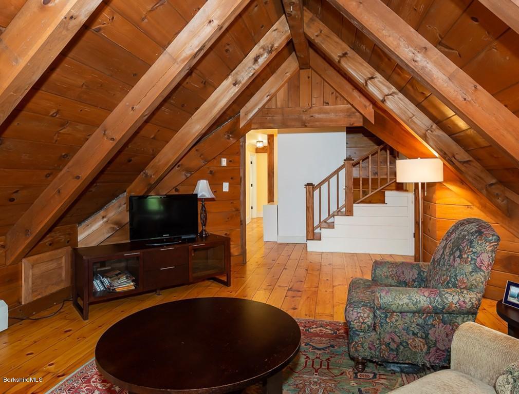 430 East River Road Chester, MA 01011 - Photo 38 of 42 a living room with couches a flat screen tv and a table