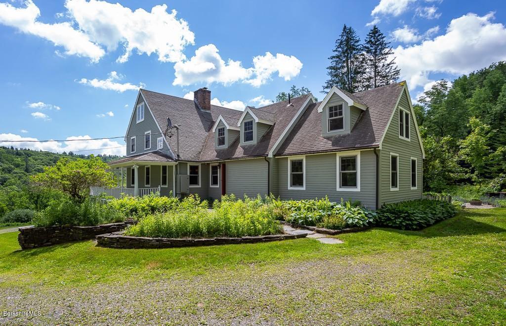 430 East River Road Chester, MA 01011 - Photo 7 of 42 a front view of a house with a yard