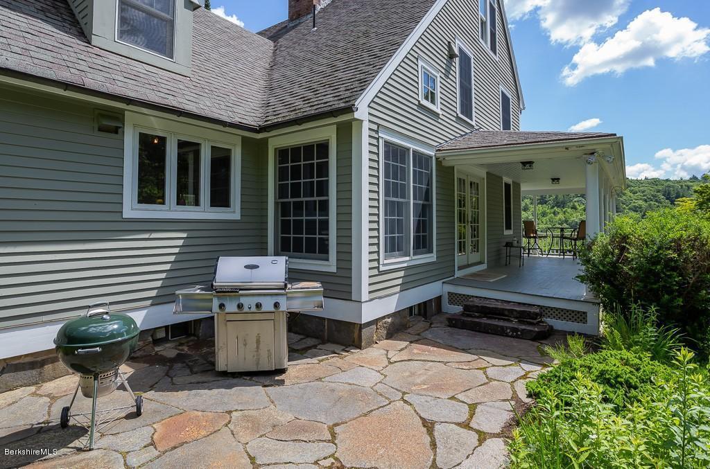 430 East River Road Chester, MA 01011 - Photo 9 of 42 a backyard of a house with seating space