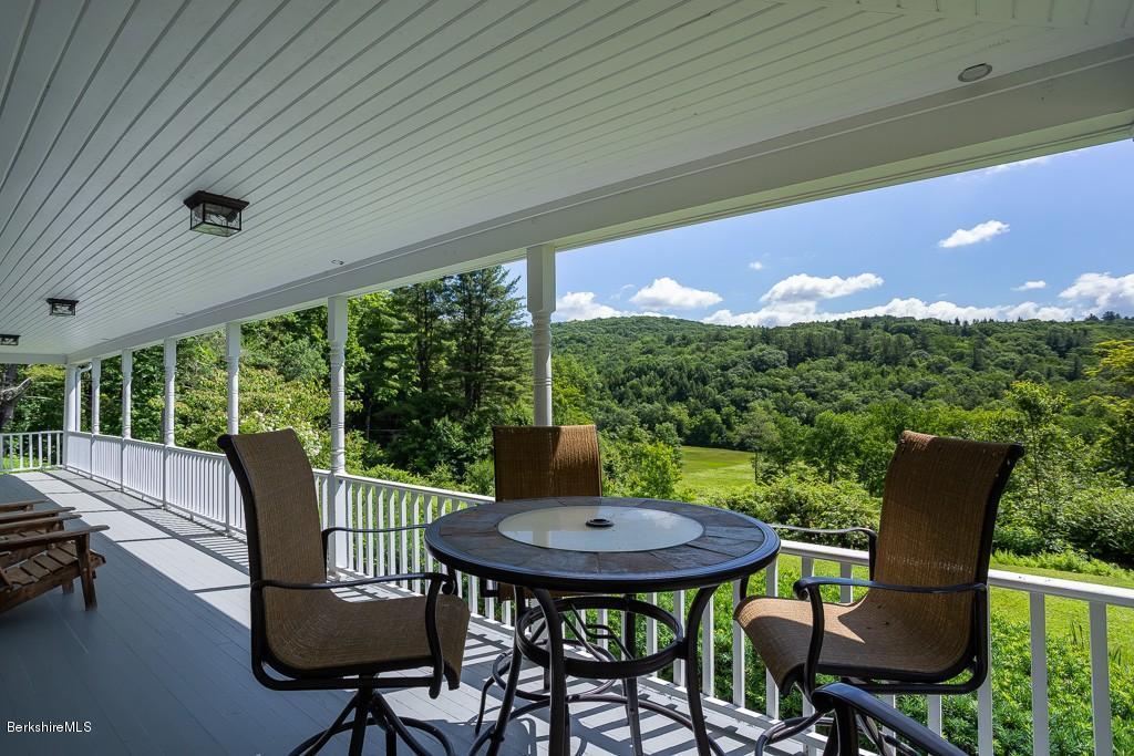430 East River Road Chester, MA 01011 - Photo 10 of 42 a view of a patio with a table chairs and a yard