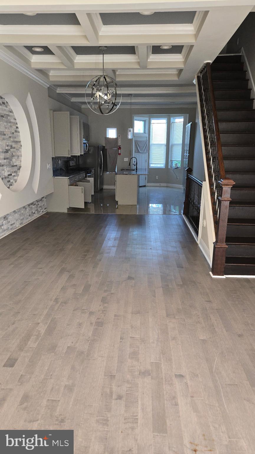1816 McCulloh Street Baltimore, MD 21217 - Photo 1 of 15 a view of a hallway with stairs and chandelier