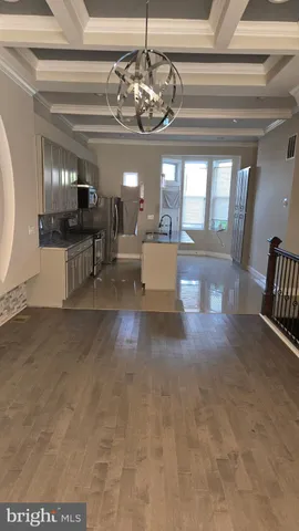a view of living room with furniture and a chandelier