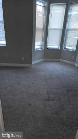 an empty room with a empty space and window