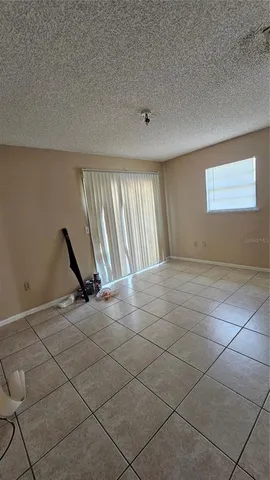 a view of an empty room with windows