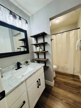 a bathroom with a sink and a mirror