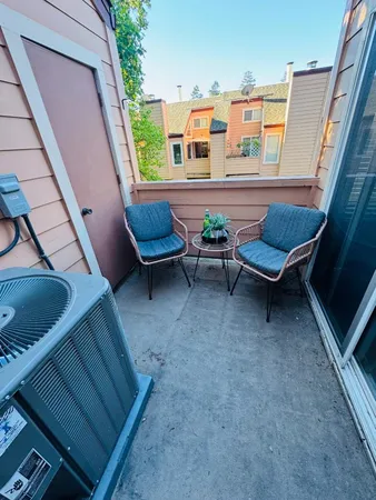 a view of a chairs and table in patio
