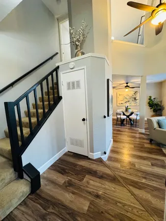 a view of a living room and hardwood floor
