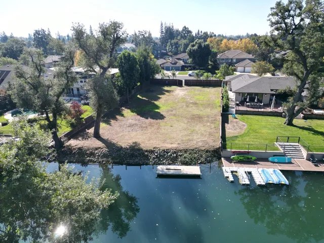 an aerial view of a house with yard swimming pool and outdoor seating