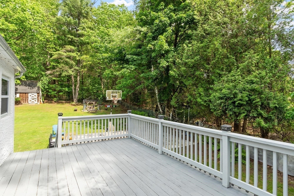 144 Bailey Road Holden, MA 01520 - Photo 36 of 42 a view of deck and backyard with trees