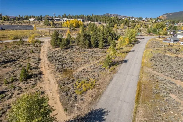 a view of a city with mountains in the background