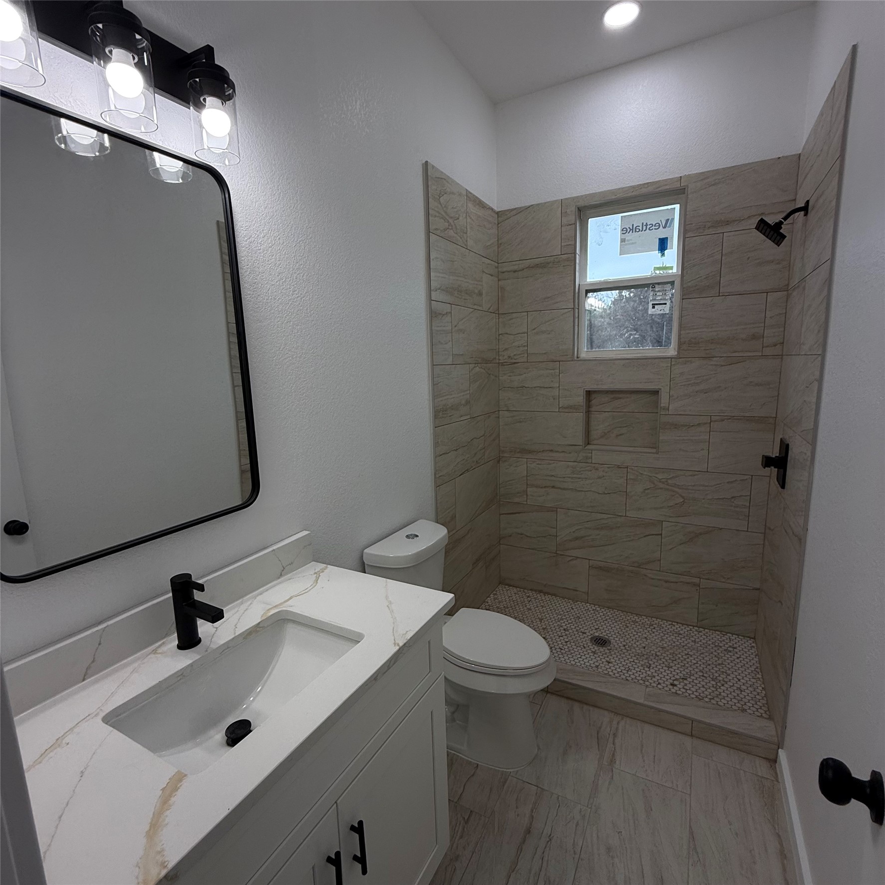 118 Crazy Cross Road Wimberley, TX 78676 - Photo 13 of 18 a bathroom with a sink a toilet and shower