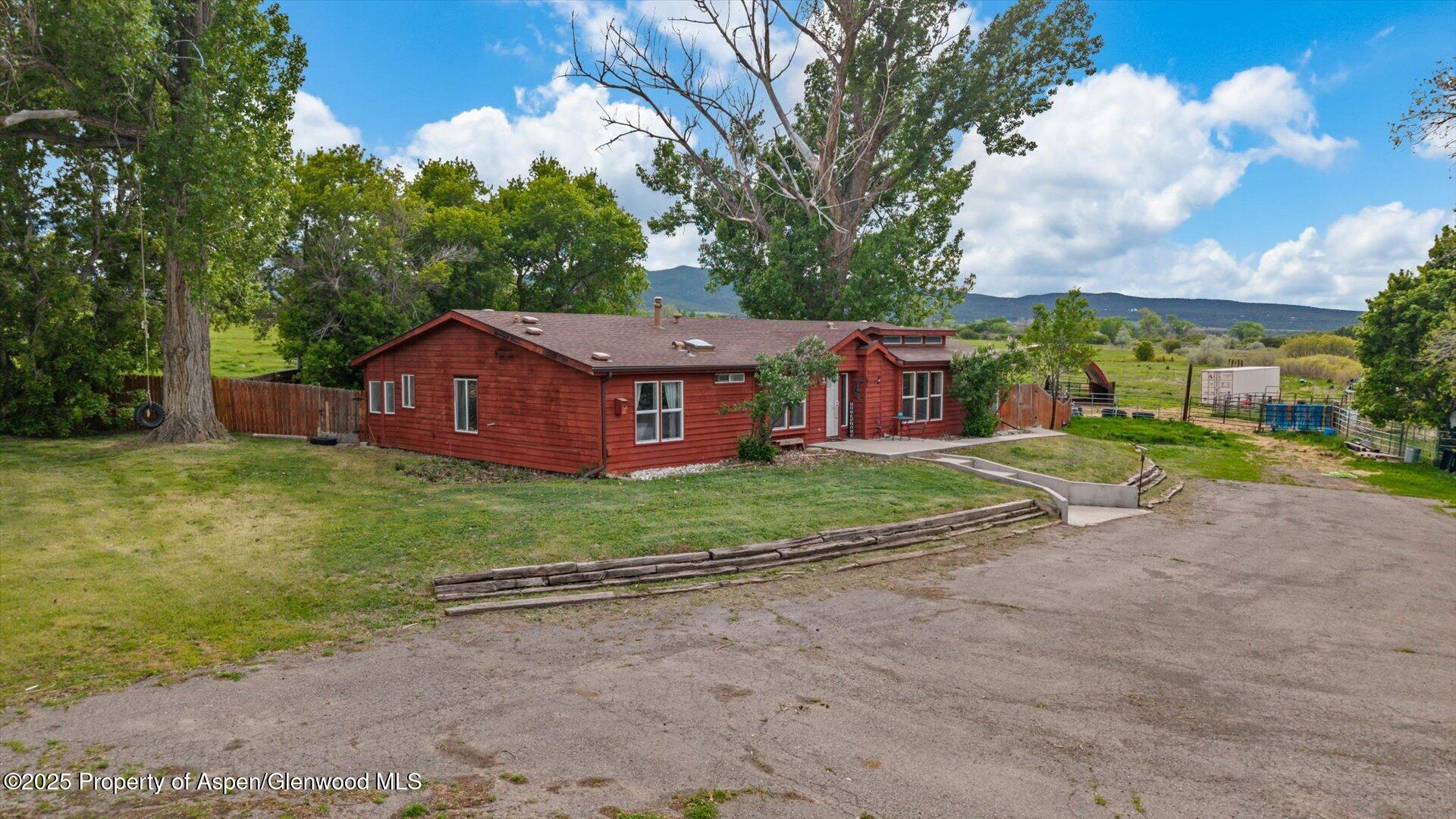 10479 50 Road Mesa, CO 81643 - Photo 2 of 42 a view of a house with a backyard